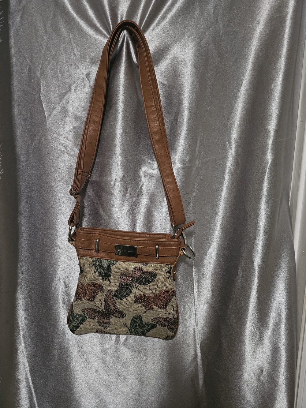 Braciano tapestry crossbody bag features a distinctive butterfly pattern